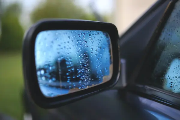 A side view mirror is helpful, but can’t eliminate all blind spots.